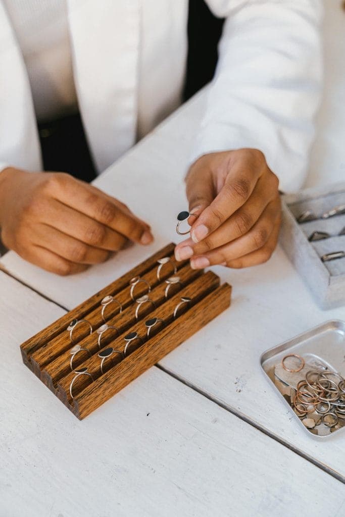 Several engagement ring styles arranged neatly in a ring box