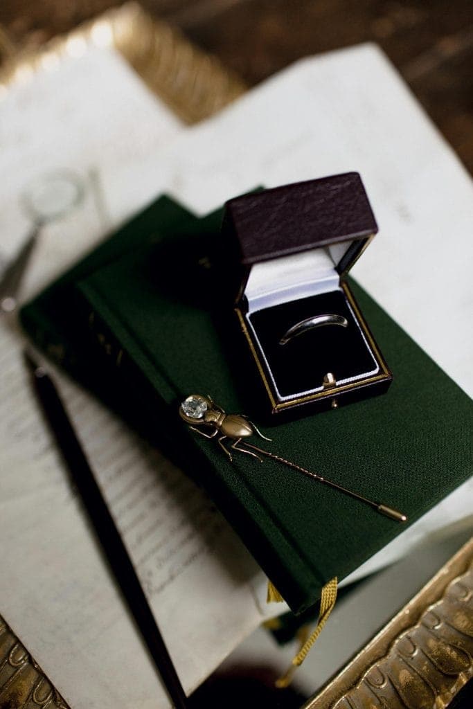 Valuation report beside a ring and gemstone tray